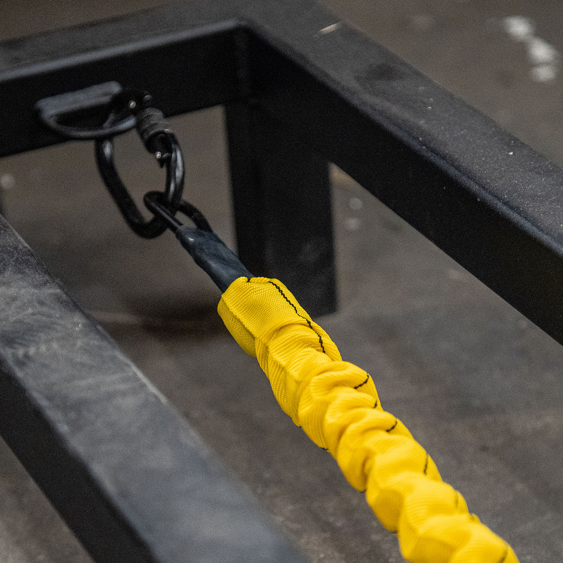 elastic extension spring attached to a metal bar